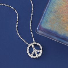 Ross-Simons - .10ct t. w. Diamond Peace Sign Pendant Necklace in Silver. 20". An RS exclusive. Radiate peace and happiness when you don this pendant necklace. The dazzling piece features a polished sterling silver peace sign with .10 ct. t. w. diamonds. Suspends from a rope chain. Springring clasp, diamond peace sign pendant necklace. Diamond birthstones are the perfect gift for April birthdays. Symbolic Round Peace Sign Jewelry, Peace Sign Jewelry For Gifts, Peace Sign Ring, Pendant Necklace Diamond, Peace Sign Necklace, Peace And Happiness, Diamond Birthstone, Necklace Diamond, Ancient Symbols