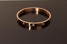 Absolutely gorgeous bracelet that adds an additional pop to your accessories. Available in plated Sliver, rose gold, and gold. One size fits most. Circumference is approximately 7.4 inches 0.27 wide thickness 2.4in inner space Trendy Rose Gold Metal Cuff Bracelet, Modern Rose Gold Party Bracelets, Trendy Rose Gold Metal Bangle, Modern Rose Gold Bangle For Party, Modern Rose Gold Party Bangle, Modern Rose Gold Cuff Bracelet For Party, Modern Rose Gold Party Cuff Bracelet, Rose Gold Metal Bangle, Modern Rose Gold Stainless Steel Bangle