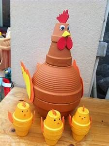 a clay hen and her chicks on a wooden table