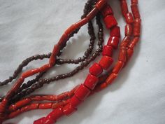 Here we have a Vintage 7 Strand Brown Red Shell Necklace, Native American Brown Red Shell Necklace, Southwest Brown Red Shell Necklace, Heishi Shells Red. This is a wonderful summertime Shell Necklace and it is in good condition with no flaws that we can see and it is 7 strands and 24 inches long as well. The color tone is brown and red and the beads are of different shapes and sizes but there are plenty of them... Any questions ask away... Multi-strand Red Coral Necklace, Red Multi-strand Coral Beaded Necklaces, Cat Piggy Bank, Spencers Gifts, Vintage Dressers, Brass Necklace, Shell Necklace, Color Tone, Chunky Necklace