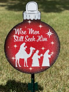 a red ornament with the words jesus is the reason for the season on it