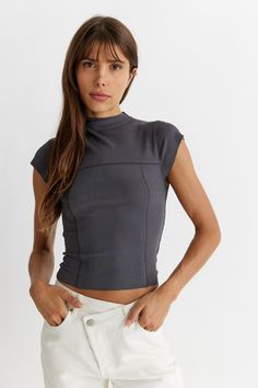 - Exposed seams with contrast stitching -Cropped, ribbed tee with silhouette fit -Mock neck Mock Neck Top Outfit, Contrast Stitch Top, Mock Neck Short Sleeve, Ribbed Tee, Mock Neck Tank, Tulip Sleeve, Exposed Seams, Skirt And Blouse, Clothes Sewing Patterns