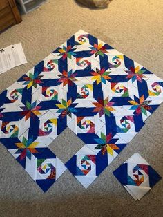 the quilt is laying on the floor and ready to be sewn