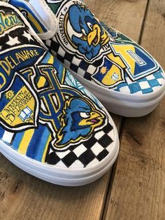 Custom, hand painted slip on Vans   University of Delaware Blue Hens sneakers.  Can be done in Converse with your school or logo! Contact me to create your custom pair! Blue Custom Artwork Sneakers, Custom Hand Painted Blue Sneakers, Custom Blue Hand Painted Sneakers, Artistic Custom Blue Sneakers For Streetwear, Artistic Blue Custom Sneakers For Streetwear, Blue Custom Artwork High-top Sneakers, Blue High-top Sneakers With Custom Artwork, Blue Sporty Custom Hand Painted Sneakers, Artistic Blue Sneakers With Custom Artwork