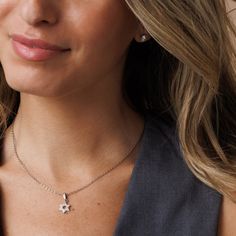 Elevate your style with our Women's Silver Star of David Necklace adorned with a filled zirconia diamond setting. This chic Magen David pendant, made of stainless steel with a dazzling rhodium cover, offers a contemporary reinterpretation of tradition while accentuating its allure with zirconia diamonds. Shower-safe and tarnish-free, it's the ideal accessory for individuals seeking sophistication and elegance. Choose between: A stunning gold hue, crafted from 14K gold-filled material. An elegant silver shade, made of stainless steel with a rhodium cover Star-shaped Cubic Zirconia Jewelry With Sparkling Stones, Cubic Zirconia Star Jewelry With Sparkling Stones, Star Shaped Cubic Zirconia Jewelry With Sparkling Stones, Dazzling Star-shaped Cubic Zirconia Jewelry, Silver Star-shaped Jewelry With Sparkling Stones, Sterling Silver Star Jewelry With Sparkling Stones, Silver Star Of David Charm Jewelry, Fine Jewelry Star-shaped Cubic Zirconia, Star-shaped Cubic Zirconia Jewelry Gift