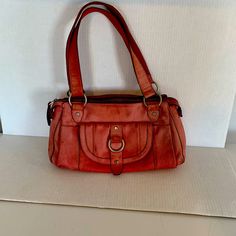 Fossil Long Live Vintage 1954 Women’s Faded Red Distressed Leather Satchel Bag 1 Snap Pocket Silver Hardware Zipper Closure Stitch Detail Clean Red Lining Inside 1 Zip Pocket 2 Pouches 14” Length 8” Tall 10” Drop Great Condition Red Leather-lined Satchel For Everyday Use, Red Textured Leather Rectangular Satchel, Red Leather Satchel With Silver-tone Hardware, Red Rectangular Satchel With Silver-tone Hardware, Red Satchel Shoulder Bag With Gold-tone Hardware, Fossil Bags, Leather Satchel Bag, Satchel Purse, Distressed Leather