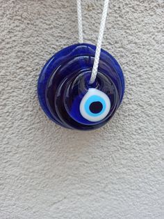 "material: Glass evil eye Big evil eye size : 10 cm , 7 cm, 5.5 cm, 4.5cm , 3.5 cm, 2,5 cm Note: If you want other size please contact me The amulets, which are handmade by melting in fire, are produced by the \"free-shaping\" production method, which requires four people to work in harmony at the same time, so the talisman is not exactly the same as it differs in production techniques. It is wholesale and the wholesale price is much more affordable. quality handmade evil eye You can use it in a Handmade Blue Evil Eye Bracelet, Evil Eye Wall Decor, Eye Wall Decor, Blue Anklet, Wall Decor Blue, Glass Evil Eye, Handmade Evil Eye, Minimal Necklace, Amulet Necklace