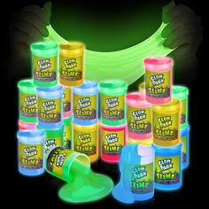 glow in the dark paint is shown with hands holding it up to show off its colors