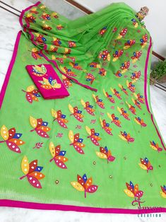 Colorful Applique work on Bengal Handloom Resham Kota Saree. Here, we have done a Lotus Applique on the semi-translucent Handloom Resham Kota saree. this 'Poddo' has multi-color petals, and the use of mirrors [foil] on the petals brings the shine of The festival of light. The applique design goes up from the corner of the palla to the upper yoke then diagonally goes down to the lower border and continues to the rest of the borderline of the saree. After draping the saree the lines of the flower wraps so beautifully and will look very gorgeous. It has a matching applique worked blouse piece. The saree is very light in weight, easy to drape, and very comfortable. Material: Bengal Handloom Resham Kota Work: Applique work Saree length: 5.5 meters Saree width: 47 inches Blouse: Yes, with a matc Cotton Saree With Resham Embroidery, Cotton Saree With Resham Embroidery For Festivals, Festival Cotton Saree With Resham Embroidery, Multicolor Cotton Saree For Puja, Green Semi-stitched Handloom Blouse Piece, Handloom Semi-stitched Cotton Saree, Semi-stitched Cotton Handloom Saree, Green Resham Embroidery Saree For Puja, Multicolor Cotton Dupatta With Cutdana