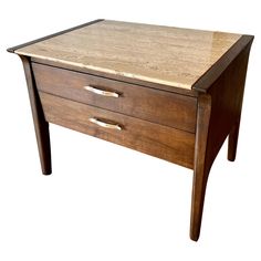 a wooden table with two drawers on one side and an open drawer on the other