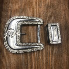 "A set of 3 silver tone metal southwestern/cowboy style belt buckle parts. I'll do my best to describe these but I have to admit that I know nothing about using these to ornament a belt. I just fell in love with the color and details on these pieces. I also am not able to identify the metal. All three definitely look vintage, have wear, and have tarnished over time. Please refer to the photo numbers for the measurements given below: Photo #3 Belt Buckle - There's a small circle with the head of Western Silver Belt Buckles With Concho, Silver Belt Buckles For Western-themed Events, Western Silver Concho Belt Buckles, Silver Western Belt Buckles For Rodeo, Western Silver Belt With Antique Buckle, Silver Concho Belt Buckles For Rodeo, Vintage Silver Belt Buckles For Rodeo, Vintage Silver Belt Buckle For Rodeo, Silver Concho Belt For Western-themed Events