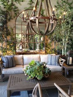 an image of a living room with plants on the wall and furniture in the background