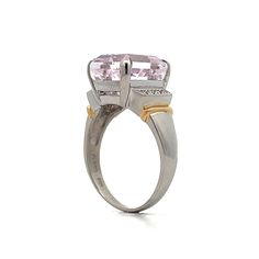 The star of this show is a stunning 9.64 carat emerald cut Kunzite. The soft pink hue of the center stone make it easy to accessorize. Adding to the glamour are six sparkling natural round brilliant cut diamonds, three on each side of the center stone. The platinum setting provides a polished backdrop for the Kunzite while and the 18 karat yellow gold accents on the shoulders add a touch of warmth to the overall design. Luxury Pink Diamond Ring For Formal Occasions, Luxury Pink Amethyst Ring With Accent Stones, Luxury Pink Amethyst Gemstone Ring, Luxury Amethyst Ring With Emerald Cut Diamond, Luxury Emerald-cut Diamond Amethyst Ring, Luxury Emerald Cut Amethyst Ring With Diamond Setting, Luxury Pink Topaz Ring With Diamond, Luxury Pink Topaz Ring, Luxury Pink Topaz Ring For Formal Occasions