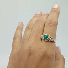 Green onyx Gemstone 925 silver ring with stylish design for your daily wearing accessories. This green stone also know as green onyx stone boho ring can make your daily fashion goals more interesting  and trendy. The green onyx associated with Mercury (Buddha) planet. which help you to financial clearance and sort out, educational and medical recovery   and help you to maintain it. If you searching for something that gives your fashion style extra wing and helps you in health benefits, financial success than this stone ring is for you. This can be the perfect gift for your loved ones, family and friends.  Rings Details  Metal: 925 Sterling Silver Gemstone : Green onyx Gemstone Shape: Round SKU :  Ring59 Ring Size : All Size Available For more new arrivals  and discount please favorite our Adjustable Fit Emerald Ring, Bohemian Sterling Silver Emerald Ring, Bohemian Adjustable Emerald Open Ring, Bohemian Emerald Adjustable Open Ring, Bohemian Green Crystal Ring, Adjustable Green Crystal Gemstone Ring, Handmade Green Stackable Rings For May Birthstone, Bohemian Green Rings With Natural Stones, Bohemian Green Crystal Round Ring