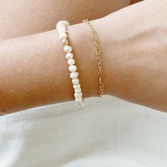 Every freshwater pearl bracelet is unique since every natural freshwater pearl varies slightly in shape, size, and color! Pearl is the traditional 3 year anniversary gift as well as the June birthstone! This beachy bracelet is adjustable from 6 to 8 inches, so you may able to wear it as an anklet as well! The extender is gold filled, so it is hypoallergenic & tarnish resistant for up to 30 years of everyday wear! All of my jewelry is shipped in 100% recyclable honeycomb mailers to protect your j Delicate White Bracelets For Everyday Wear, Pearl White Oyster Bracelet As A Gift, Hypoallergenic Pearl Bracelet With Round Beads For Everyday, Hypoallergenic Pearl Bracelet With Round Beads, Classic White Pearl Bracelet For Mother's Day, Elegant White Pearl Heart Bracelet, Delicate Beaded Oyster Bracelets For Gift, Everyday Pearl Bracelets With Round Beads, Everyday White Pearl Bracelet With Extender