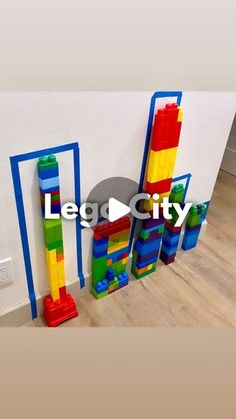 there are legos on the wall and in front of it is a video game called leg city