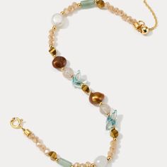 Embrace the vibrant energy of summer with our Colorful Natural Stone Beaded Bracelet! This delightful piece features a playful mix of colorful gemstones, strung on a durable brass base plated in gleaming 18K gold. Freshwater pearls add a touch of elegance, making this colored bracelet bracelet a must-have for any outfit. Whether you're dressing up for a special occasion or keeping it casual, the Colorful Natural Stone Beaded Bracelet is sure to turn heads. Find your perfect combination of natura Gold Bracelets With Gemstone Beads For Beach, Bohemian Gold Pearl Bracelet With Gemstone Beads, Gold Bohemian Pearl Bracelet With Gemstone Beads, Gemstone Beads Bracelet Jewelry For Beach, Gold Beaded Bracelets With Gemstone For Beach, Gold Gemstone Beaded Bracelets For The Beach, Beach Bracelets With Natural Stones And Round Beads, Natural Stone Beaded Bracelets For The Beach, Gold Faceted Beads Bracelets For Beach