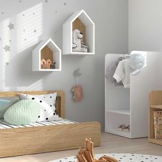 a child's bedroom decorated in white and wood with stars on the wall above