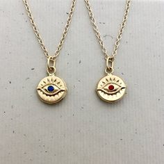 ⇩CLICK BELOW FOR DETAILS⇩Please note that I make every effort to mail your order within 24 hours of receipt. However, USPS is experiencing significant delivery delays and many packages are taking 2-3 weeks to arrive.Made of all 14kt gold filled, this beautiful evil eye necklace has a 11.5mm disc shaped evil eye charm with a tiny and bright faceted synthetic blue sapphire or red ruby center stone.  The charm is identical on both sides, and hangs a jump ring from a delicate 14kt gold filled chain, Spiritual 14k Gold Charm Necklace With Round Pendant, 14k Gold Spiritual Round Pendant Charm Necklace, 14k Gold Filled Spiritual Necklaces, Spiritual Tarnish-resistant Round Pendant Charm Necklace, Gold Plated Round Amulet Charm Necklace, Symbolic Evil Eye Jewelry For Meditation, Spiritual Round Gold Plated Charm Necklaces, Spiritual Evil Eye Round Necklace, Spiritual Evil Eye Necklace