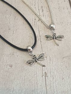 Lovely Dragonfly Charm Necklace Antique silver charm on either black waxed cord or silver plated curb chain The waxed cord is approx 18.5 inches long which includes the extension chain The silver plated chain is available in either 18 or 20 inch lengths Your necklace will be lovingly packaged inside an organza gift bag can be sent direct to the recipient if required, please leave a note at the time of checkout All items are posted free of charge via Royal Mail second class post the same or next working day I have many more necklaces and earrings for sale including a complete Dragonfly set which consists of matching earrings and necklace Please note overseas deliveries are taking longer than usual to arrive so please allow a delay in receiving your order. All orders outside of the UK are no Silver Necklaces With Adjustable Length And Waxed Cord, Minimalist Silver Necklace With Waxed Cord, Silver Necklace With Adjustable Length And Waxed Cord, Silver Waxed Cord Necklace For Gift, Silver Necklace With Waxed Cord For Gift, Adjustable Black Sterling Silver Charm Necklaces, Silver Casual Necklace With Adjustable Length, Casual Silver Necklace With Adjustable Length, Adjustable Black Charm Necklace