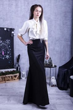 - Long taffeta skirt- High waist silhouette design- Silk top with a bow tie- 25+ colors of silk Model wears size US 8, she is 180 cm tallPlease, use this size chart to select your sizeUS 0 >>> Bust 82 cm (32.5 inches) Waist 64 cm (25 inches) Hips 89 cm (35 inches)US 2 >>> Bust 85 cm (33.5 inches) Waist 66 cm (26 inches) Hips 92 cm (36 inches)US 4 >>> Bust 88 cm (34.5 inches) Waist 68 cm (27 inches) Hips 94 cm (37 inches) US 6 >>> Bust 90 cm (35.5 inches) Waist Fitted Dress With Long Skirt For Office, Fitted Long Skirt Dress For Office, Formal Black Gathered Skirt, Fitted Office Dress With Long Skirt, Fitted Long Skirt Office Dresses, Elegant Fitted Pencil Skirt With Gathered Detail, Formal Fitted Maxi Skirt With Gathered Detail, Elegant Fitted Maxi Skirt For Formal Occasions, Elegant Full Skirt For Office