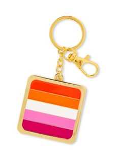 a keychain with an orange, pink, and white stripe design on it