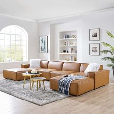 a living room filled with furniture and a large window