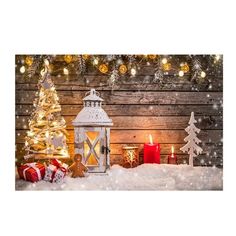 a christmas scene with lit candles and presents in front of a wooden wall covered in snow