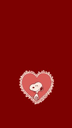 a red heart with a cartoon dog on it