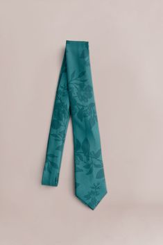 It's a perfect color match! Our Satin Floral Print Tie will provide that finishing touch to your cohesive wedding look! Classic in design our tie lends a stylish and comfortable fit. FEATURES: Semi-shine charmeuse satin material, unlined Classic narrow-width design Our Revelry custom floral prints are designed as tonal watercolor patterns and come in three sizes; a small ditsy print "posey", a modern medium print "bouquet", and a larger floral print with less background space "garden". Each prin Emerald Bouquet, Sage Bouquet, Satin Colors, Space Garden, Wedding Parties Colors, Watercolor Patterns, Background Space, Dreamy Aesthetic, Branding Inspo