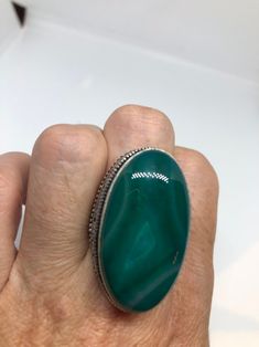 Large green agate Ornate German Silver Vintage ring, does not tarnish Size 9 can be re sized, my jeweler charges a $10 - $15 fee All rings are shipped in a nice gift box. Check out our over a THOUSAND great reviews Engraving is $4 per letter and is not always perfect depending on the piece. It can take a few days if the jeweler is busy. This is payable to Paypal Judithsltd@gmail.com Green Malachite Rings As A Gift, Green Oval Rings With Large Stone, Green Oval Ring With Large Stone, Oval Green Ring With Large Stone, Green Ring With Large Stone, Green Onyx Rings For Gift, Green Agate Oval Rings, Green Oval Agate Rings, Handmade Green Oval Crystal Ring