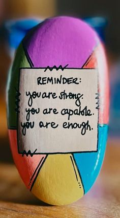 an egg with a message on it sitting on a table