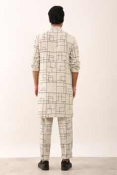 Ivory rolled up sleeves kurta in 100% linen base with all over tartan checks print and pintuck details on the collar, cuff and placket. Paired with a matching trouser. - Aza Fashions Checks Print, Kurta Set Men, Rolled Up Sleeves, Kurta Set For Men, Roll Up Sleeves, Kurta Set, Pin Tucks, Mandarin Collar, Aza Fashion