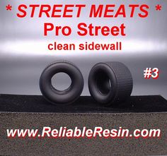 there are two tires sitting on top of a stand that says, street meats pro street clean sidewalk