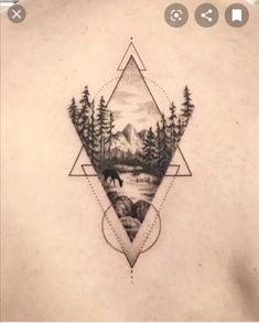 a man's back with an image of trees and mountains in the middle of it