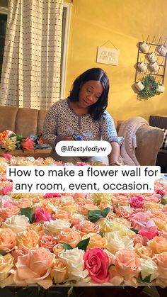 a woman sitting at a table with flowers in front of her and the caption how to make a flower wall for any room, event, occasion