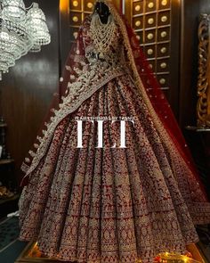 a red and gold bridal gown on display