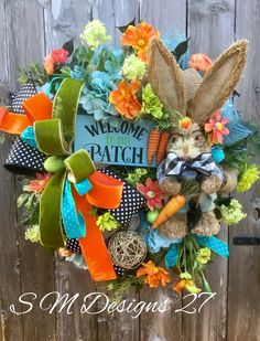 a wreath with an image of a bunny and carrots on it that says welcome patch