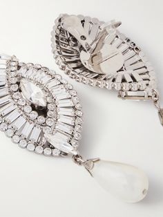 Find ALESSANDRA RICH Tone, Crystal And Faux Pearl Clip Earrings on Editorialist. Alessandra Rich's jewelry has the same glamorous, vintage-inspired appeal as the label's signature dresses - and go just as nicely. Made from silver-tone metal, these statement earrings are traced with shimmering crystals in the shape of a shell and anchored by dangling faux pearls. The clip fastening and surprisingly lightweight feel keep them comfortable. Diamond Clip-on Jewelry For Parties, Crystal Jeweled Earrings For Formal Occasions, Formal Crystal Jeweled Earrings, Formal Crystal Earrings With Jewels, Luxury Crystal Embellished Earrings For Formal Occasions, Luxury Jeweled Earrings For Formal Occasions, Opulent Silver Earrings For Evening, Silver Opulent Earrings For Evening, Luxury Jewel Earrings For Wedding