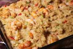 a casserole dish filled with shrimp and rice