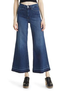 Made from superstretchy denim, these '70s-inspired palazzo jeans are remade for today with released hems and a slightly shorter inseam. 28 1/2" inseam; 28" leg opening; 12" front rise; 15" back rise (size 29) Zip fly with button closure Five-pocket style 77% cotton, 18% modal, 4% elasterell-p, 1% elastane Machine wash, dry flat Made in Turkey Spring Dark Wash Flares With Five Pockets, Spring Dark Wash Cotton Flares, Fall Wide-leg Flares With Frayed Hem, Fall Wide Leg Flares With Frayed Hem, Summer Wide-leg Flares With Frayed Hem, Dark Wash Mid-rise Flares For Spring, Spring Denim Blue Flares With Frayed Hem, Spring Medium Wash Wide Leg Flares, Spring Dark Wash Wide Leg Flares