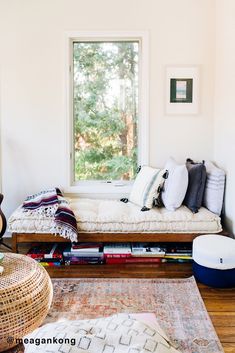 a living room with a couch, rug and window