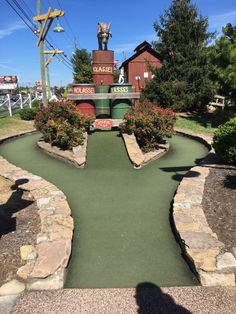 the miniature golf course is in front of a building