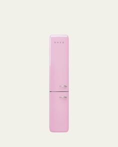 a pink refrigerator freezer sitting on top of a white wall