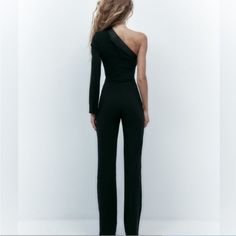 Never Worn. Excellent Condition. Form-Fitting, Sexy Yet Elegant Jumpsuit. New With Tags. Stretch Off-shoulder Bodysuit For Evening, Stretch Off-shoulder Evening Bodysuit, Elegant Stretch Pantsuit For Parties, Elegant Off-shoulder Party Bodysuit, Stretch Off-shoulder Jumpsuit For Night Out, Off-shoulder Stretch Jumpsuit For Night Out, Elegant One-shoulder Evening Bodysuit, Elegant Fitted One-shoulder Bodysuit, Fitted One-shoulder Bodysuit For Evening