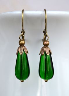 Antique Teardrop Jewelry In Antique Gold, Antique Teardrop Brass Jewelry, Antique Brass Teardrop Jewelry, Green Vintage Charm Brass Jewelry, Green Brass Jewelry With Vintage Charm, Vintage Green Brass Jewelry, Vintage Nickel-free Jewelry For Festive Occasion, Nickel-free Vintage Jewelry For Festive Occasions, Vintage Antique Gold Festive Jewelry