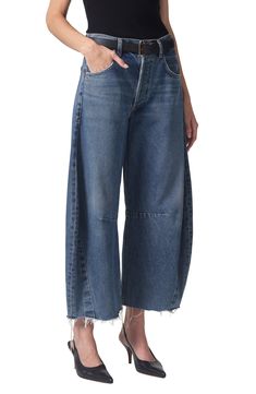 A superhigh waist and structured, curved wide legs cut a chic silhouette in these oversized, raw-cropped jeans crafted from nonstretch denim. 26" inseam; 21" leg opening; 13" front rise; 16" back rise (size 29)
 Button fly Five-pocket style 100% cotton Machine wash, tumble dry Made in the USA import of fabrics Modern Wide Leg Cropped Jeans, Casual Wide Leg Deconstructed Bottoms, Modern Rigid Denim Cropped Bottoms, Modern Cropped Rigid Denim Bottoms, Modern Wide Leg Cropped Jeans For Spring, Spring Wide Leg Deconstructed Jeans, Chic Wide Leg Cropped Jeans With Belt Loops, Wide Leg Deconstructed Denim Jeans, Chic Wide Leg Rigid Denim Pants