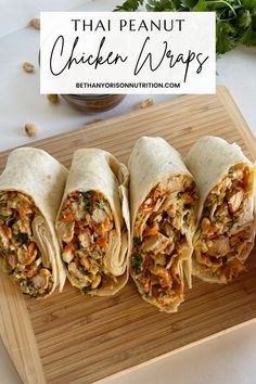 four chicken wraps on a cutting board with the words thai peanut chicken wraps above them