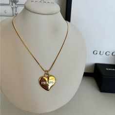 Perfect Conidion Prada Necklace Elegant Jewelry With Logo Charm Heart Pendant, Elegant Jewelry With Heart Pendant And Logo Charm, Elegant Heart Pendant Jewelry With Logo Charm, Luxury Heart Pendant Necklace, Designer Jewelry For Valentine's Day, Prada Necklace, Gold Heart, Heart Of Gold, Womens Jewelry Necklace