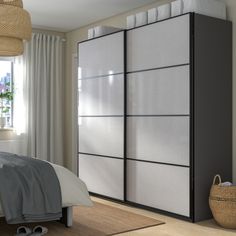 a bedroom scene with focus on the bed and closet